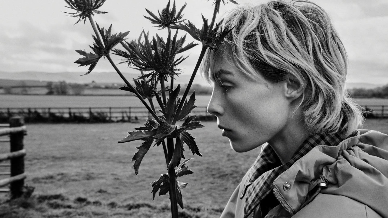 women holding thistle in Barbour jacket
