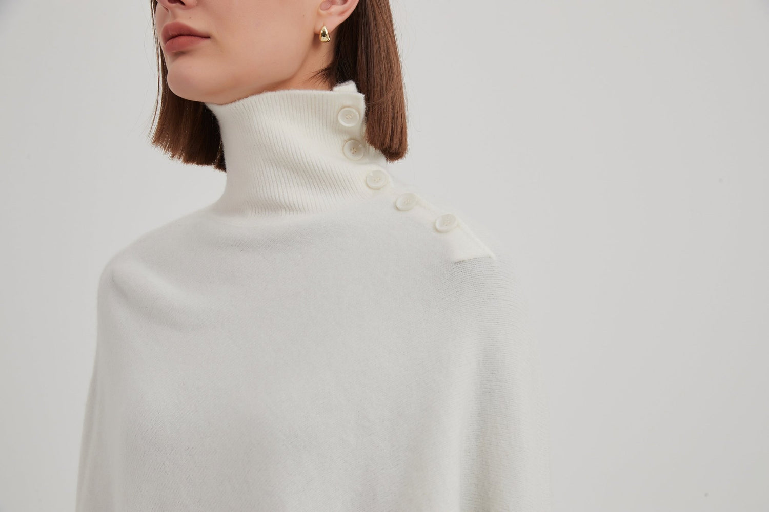 TirelliTirelli Button Detail Asymmetric PonchoClothingCream - Blue Water Clothing